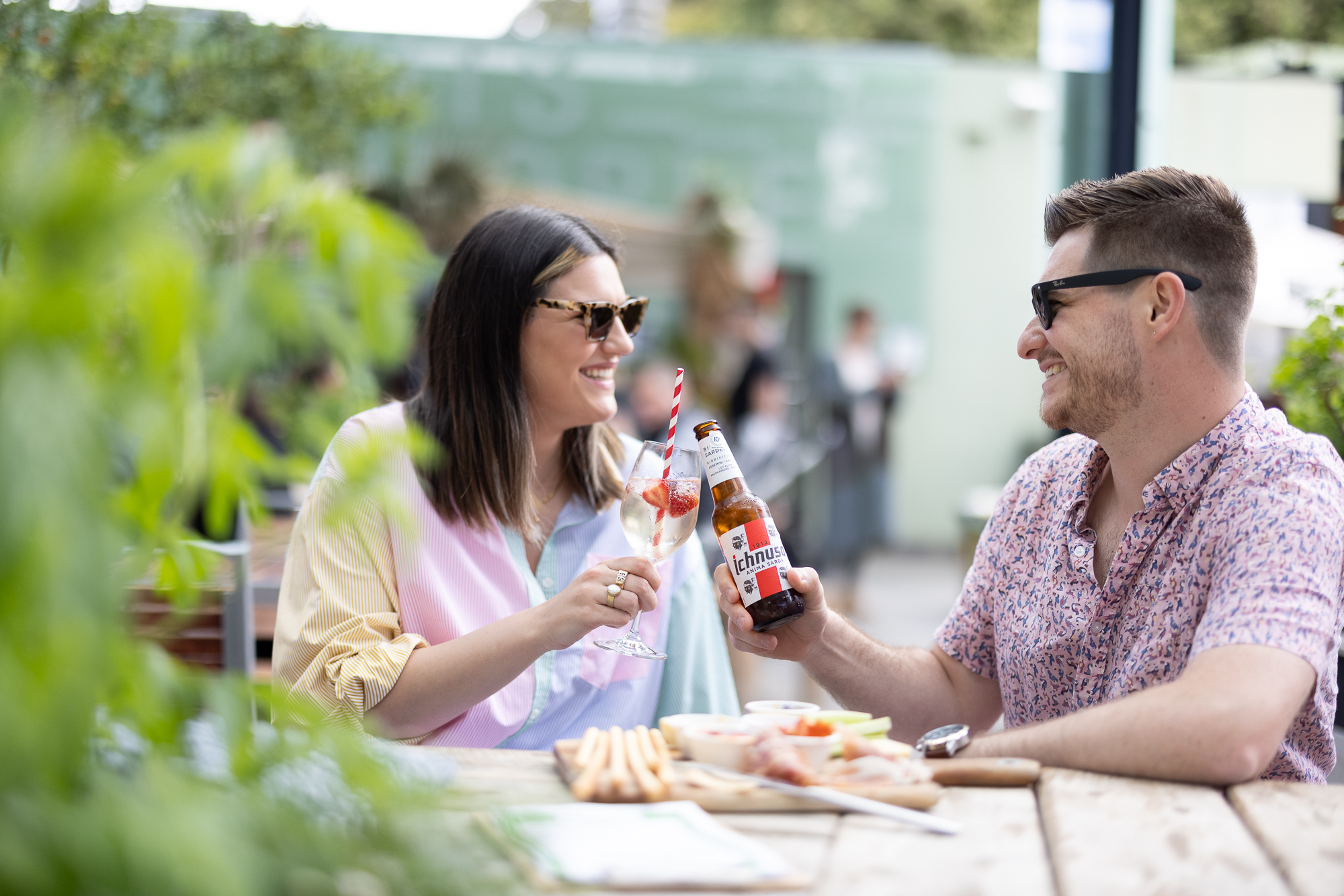Friends having a beer and a cocktail
