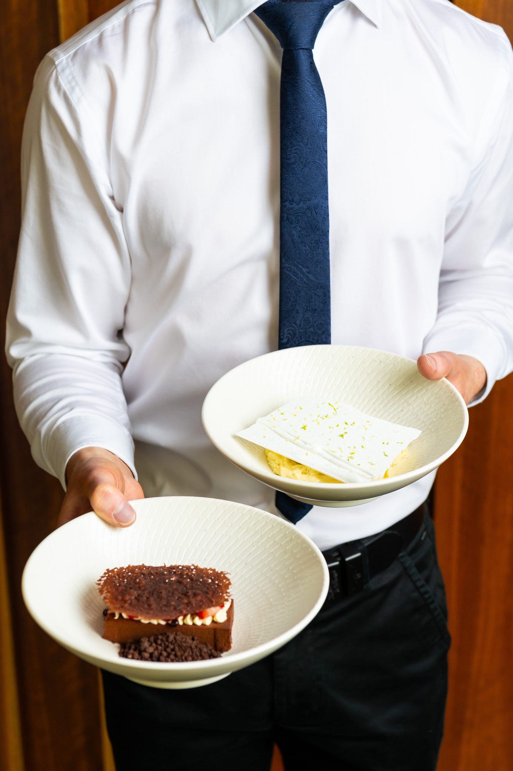 Selection of cakes held by personnel